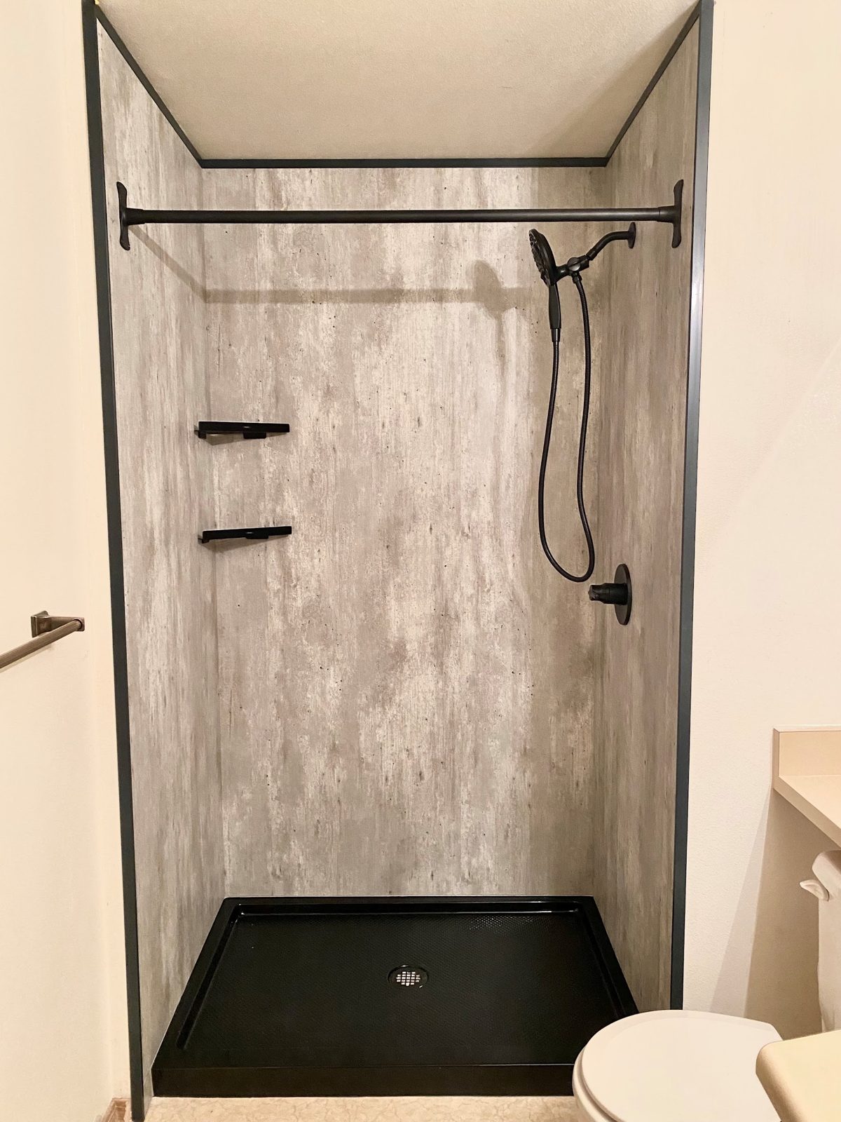 Completed shower with wood-look wall panels